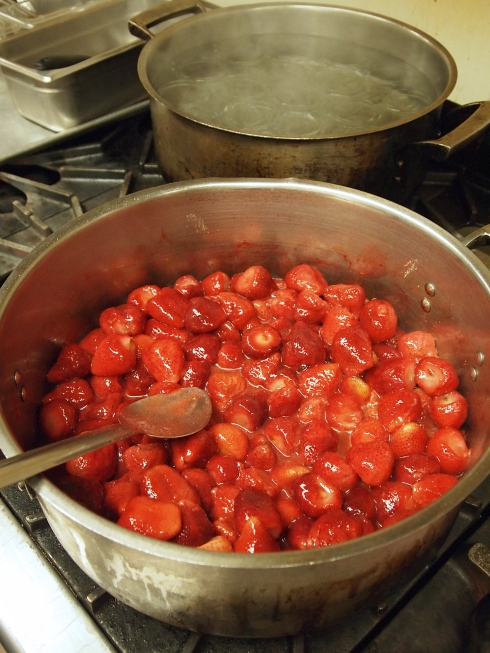 Cooking away some strawberries for jam